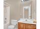 Bathroom featuring a shower-tub combo and a large mirror over the sink at 7536 Bimini Ct, Sherrills Ford, NC 28673