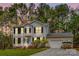 Charming two-story home with gray siding, black shutters, landscaped yard, and attached garage at 7536 Bimini Ct, Sherrills Ford, NC 28673
