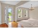 Inviting living room with hardwood entry, carpeted area, and natural light from large windows at 7536 Bimini Ct, Sherrills Ford, NC 28673