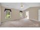Spacious main bedroom with carpet, vaulted ceilings, and ensuite bathroom at 7536 Bimini Ct, Sherrills Ford, NC 28673