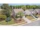 Aerial view of a two-story home showcasing mature landscaping and a desirable neighborhood at 7638 Carrington Forest Ln, Matthews, NC 28105