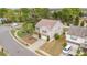 Aerial view of a two-story home showcasing manicured lawns and a peaceful neighborhood setting at 7638 Carrington Forest Ln, Matthews, NC 28105