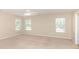 Bright, carpeted bedroom with multiple windows and neutral walls offering lots of natural light at 7638 Carrington Forest Ln, Matthews, NC 28105