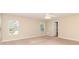 Carpeted bedroom featuring neutral walls, natural light and ensuite access at 7638 Carrington Forest Ln, Matthews, NC 28105
