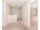 Hallway with carpeted floor and neutral paint at 7638 Carrington Forest Ln, Matthews, NC 28105
