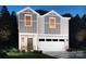 Inviting two-story home featuring a two-car garage, craftsman details, and manicured landscaping at 812 Blue Canyon Dr, York, SC 29745