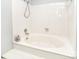 White tiled bathtub with shower head at 8257 Legare Ct, Charlotte, NC 28210