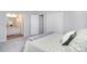 Cozy bedroom featuring connecting full bath, neutral colors and carpet at 8257 Legare Ct, Charlotte, NC 28210