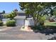 Well-maintained exterior featuring an attached garage, side yard, and mature trees at 8257 Legare Ct, Charlotte, NC 28210
