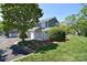 Well-maintained townhouse with green lawn and mature landscaping at 8257 Legare Ct, Charlotte, NC 28210