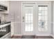 Kitchen with exterior door that leads to patio seating area at 8257 Legare Ct, Charlotte, NC 28210