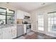 Updated kitchen with stainless appliances, stylish backsplash, and access to outdoor patio at 8257 Legare Ct, Charlotte, NC 28210