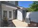 Outdoor patio area with seating, small storage, and an air conditioning unit at 8257 Legare Ct, Charlotte, NC 28210