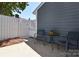Outdoor patio with table, chairs, and a white privacy fence at 8257 Legare Ct, Charlotte, NC 28210