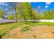 Large, grassy backyard enclosed by a white fence, perfect for outdoor activities at 911 Earl St, Shelby, NC 28150