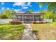 Charming home with a spacious front porch and lush landscaping, creating a welcoming curb appeal at 911 Earl St, Shelby, NC 28150