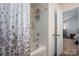 Clean bathtub and shower combination with a view to the main bedroom at 9112 Avery Meadows Dr, Charlotte, NC 28216