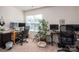 Functional home office with multiple monitors and comfortable work space at 9112 Avery Meadows Dr, Charlotte, NC 28216