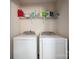 Modern laundry room with side-by-side washing machine and dryer at 9112 Avery Meadows Dr, Charlotte, NC 28216