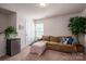 Comfortable living room offers a relaxing sofa and access to the outdoors at 9112 Avery Meadows Dr, Charlotte, NC 28216