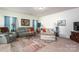 Inviting living room featuring comfortable seating, a decorative rug, and plenty of light at 9112 Avery Meadows Dr, Charlotte, NC 28216