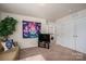 Inviting living room with cozy couch, large television, and access to other parts of the home at 9112 Avery Meadows Dr, Charlotte, NC 28216