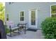 Cozy patio with a small table and chairs, perfect for enjoying the outdoors at 9112 Avery Meadows Dr, Charlotte, NC 28216