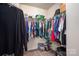 Spacious walk-in closet with ample hanging space and overhead storage at 9112 Avery Meadows Dr, Charlotte, NC 28216