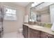 Bathroom featuring a granite vanity with lots of counter space, neutral walls, and a shower over the tub at 9208 Plashet Ln, Mint Hill, NC 28227