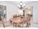 Elegant dining room featuring neutral walls, hardwood table, and decorative chandelier at 9208 Plashet Ln, Mint Hill, NC 28227