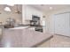 Kitchen with countertops, stainless steel appliances, and white cabinetry; well-maintained and functional at 9208 Plashet Ln, Mint Hill, NC 28227