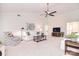 Bright living room featuring a vaulted ceiling, ceiling fan, neutral walls, and comfortable seating at 9208 Plashet Ln, Mint Hill, NC 28227