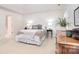 A bright main bedroom featuring a large bed with soft bedding and an ensuite bathroom at 9208 Plashet Ln, Mint Hill, NC 28227