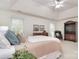 Spacious main bedroom featuring a ceiling fan, lots of natural light, and comfortable furnishings at 9208 Plashet Ln, Mint Hill, NC 28227