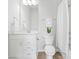 Bright bathroom featuring white fixtures, tile, and a shower-tub combo at 921 E 36Th St, Charlotte, NC 28205