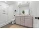 Modern bathroom with a double vanity, glass-enclosed shower, and stylish fixtures at 921 E 36Th St, Charlotte, NC 28205