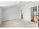 Bright bedroom featuring carpet, white walls and view to en-suite bathroom at 921 E 36Th St, Charlotte, NC 28205