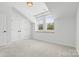 Cozy room with neutral color palette, carpet, and natural light at 921 E 36Th St, Charlotte, NC 28205