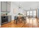Cozy dining area with modern light fixture open to the living room and kitchen at 921 E 36Th St, Charlotte, NC 28205