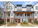 Charming townhome with modern architecture, covered porches, and inviting curb appeal at 921 E 36Th St, Charlotte, NC 28205