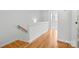 Upstairs hallway with hardwood floors and white trim at 921 E 36Th St, Charlotte, NC 28205