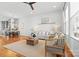 Open-concept living room featuring hardwood floors and an adjacent dining area at 921 E 36Th St, Charlotte, NC 28205