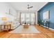 Bright living room with hardwood floors, modern furnishings, and lots of natural light at 921 E 36Th St, Charlotte, NC 28205
