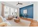 Bright living room with hardwood floors, large windows, and modern decor at 921 E 36Th St, Charlotte, NC 28205
