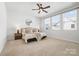 Main bedroom with plush carpet, ample natural light, and neutral tones at 921 E 36Th St, Charlotte, NC 28205