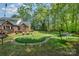 Spacious backyard with putting green, firepit, hammock, and plenty of space for outdoor activities at 127 Fantasy Ln, Mooresville, NC 28117
