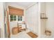 Well-lit bathroom with a window, decorative accents, and tiled floors at 127 Fantasy Ln, Mooresville, NC 28117