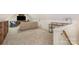 Spacious bonus room with cozy seating and a functional desk setup at 127 Fantasy Ln, Mooresville, NC 28117