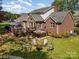 Brick house with backyard, deck, hot tub, and firepit at 127 Fantasy Ln, Mooresville, NC 28117