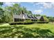Charming home with a well-maintained lawn, classic brick accents, and inviting front porch perfect for relaxing evenings at 127 Fantasy Ln, Mooresville, NC 28117